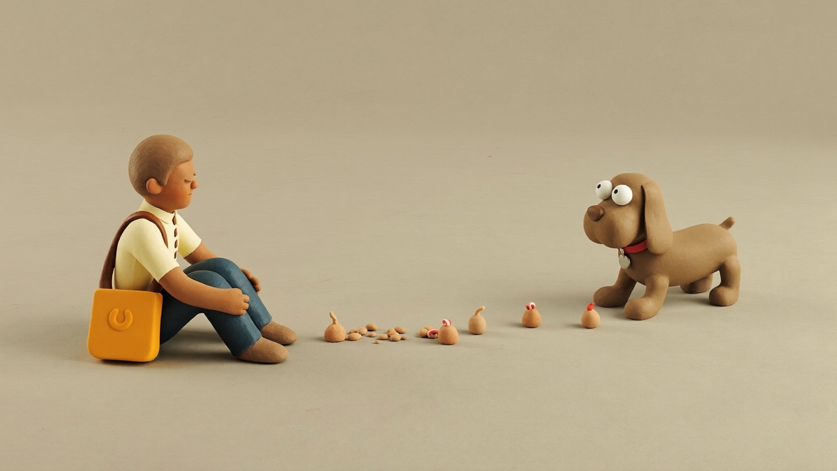 Treat-and-retreat: the visitor ignores the dog while treats land in the space between them, and the dog chooses every step